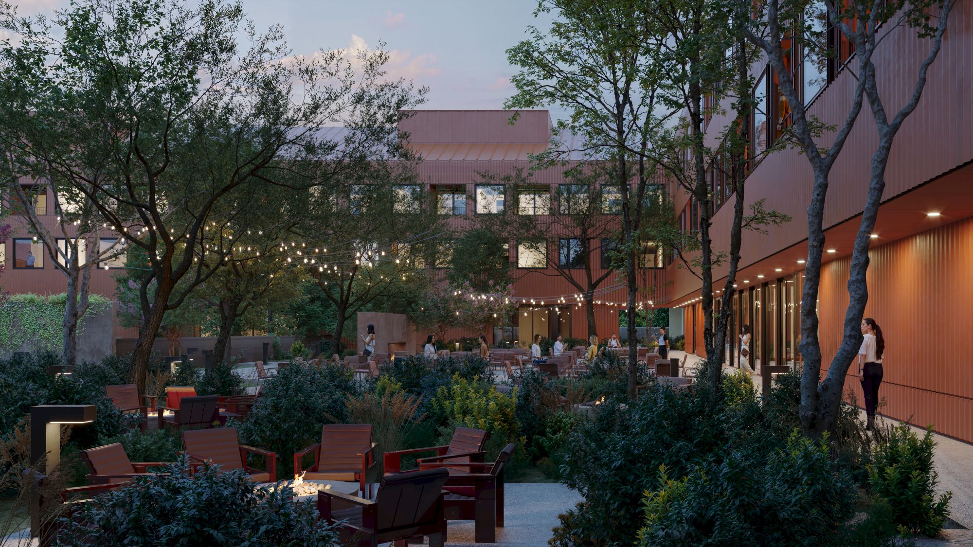 The image shows a courtyard with trees, outdoor seating, and string lights. A building with large windows surrounds the area.